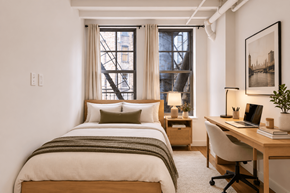 New York apartment for rent - A bedroom with a bed, desk, and chair.