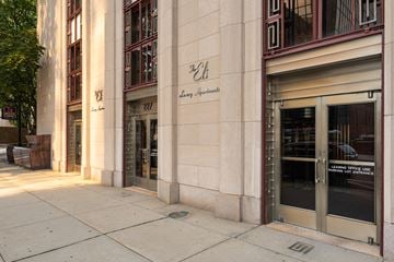 New Haven apartment for rent - The entrance to a building with a glass door and a sign that reads "Learning Office Line.".