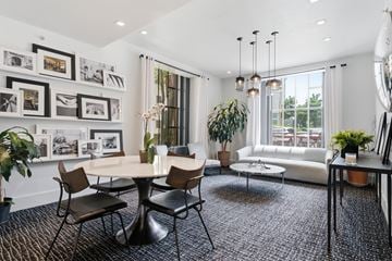New Haven apartment for rent - A modern living room with a round table and chairs.