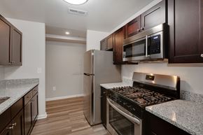 Windsor Mill apartment for rent - a kitchen with stainless steel appliances and granite counter tops and