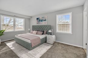 Windsor Mill apartment for rent - a bedroom with a bed and two windows