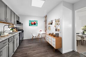 Laurel apartment for rent - A kitchen with a dining table and chairs.