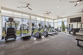 The state of the art gym is equipped with cardio equipment and floor to ceiling windows