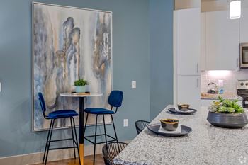 Kitchen with granite countertops and seating area