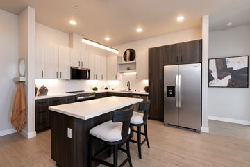 Sacramento apartment for rent - A modern kitchen with a white countertop and stainless steel appliances.