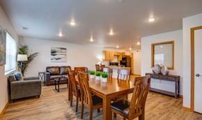 River Falls apartment for rent - A dining room with a wooden table and chairs.
