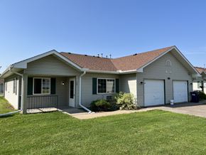 Ellsworth apartment for rent - A house with a grey roof and green shutters.