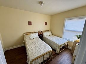 Winona apartment for rent - a bedroom with two beds and a window