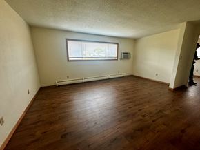 Winona apartment for rent - A room with wooden flooring and a window.