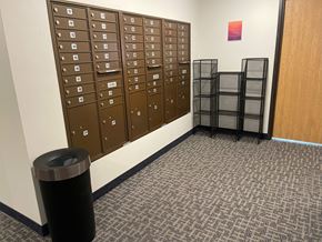 New Richmond apartment for rent - A room with a wall of lockers and a trash can.