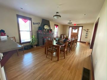 Cedar Rapids apartment for rent - A dining room with a wooden table and chairs.