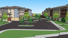River Falls apartment for rent - A street view of a residential area with apartment buildings and a roundabout.