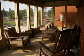Osceola apartment for rent - A sunny day in a room with a view of a parking lot through the windows.