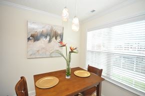 Durham apartment for rent - A dining room with a wooden table and chairs.