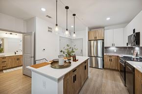 Farmers Branch apartment for rent - A large kitchen with stainless steel appliances at The Elara in Farmers Branch, Texas.