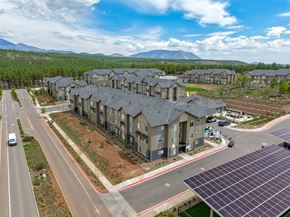 Flagstaff apartment for rent - Elevated exterior photo of Sierra on 66 in Flagstaff, Arizona highlighting the community setting and surrounding landscape