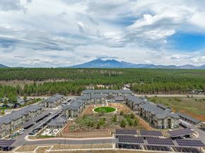 Flagstaff apartment for rent - Aerial photo of Sierra on 66 apartment community in Flagstaff, Arizona near scenic mountain surroundings