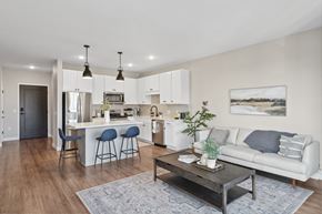 Bloomington apartment for rent - A kitchen and living room at Risor of Bloomington. 