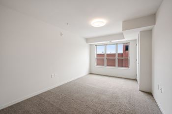 Bedroom with plush carpeting