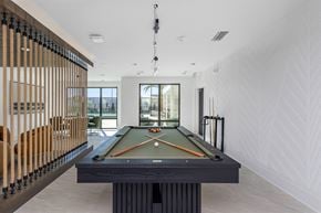 Clearwater apartment for rent - The game room with billiards at Revel in Clearwater, FL.