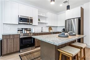 Clearwater apartment for rent - A kitchen at Revel in Clearwater, FL.