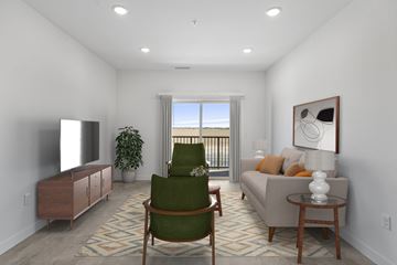 Casa Grande apartment for rent - A living room with a green chair and a couch.