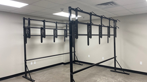 Duluth apartment for rent - A gym with a squat rack and a wall mounted pull up bar.