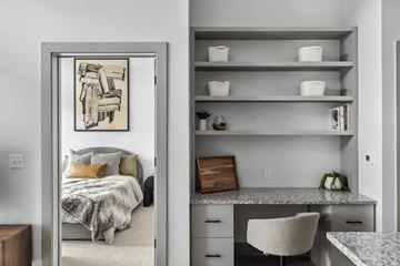 West St Paul apartment for rent - A bedroom with a bed and a mirror with a picture on it.