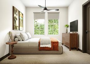 Naples apartment for rent - The bedroom with a ceiling fan and roller shades The Karlyn of Naples in Naples, Florida.