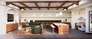 Naples apartment for rent - A modern living room with a green sofa and a wooden coffee table.