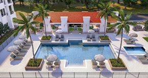 Naples apartment for rent - The east courtyard with a pergola and outdoor pool and spa at The Karlyn of Naples in Naples, Florida.