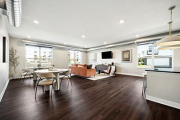 Oakdale townhouse for rent - A modern living room with a white dining table and chairs.