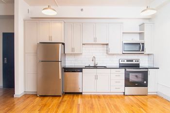 Sleek white and gray kitchen cabinetry