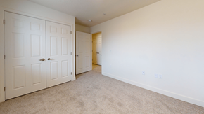 Cedar City apartment for rent - a bedroom with two closets and a door to a bathroom