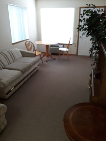 Brigham City apartment for rent - a living room with a couch and a table