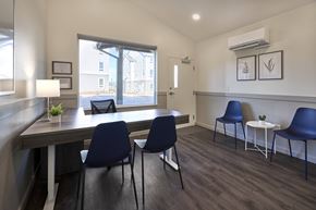 Stayton apartment for rent - a dining room with a table and chairs and a window
