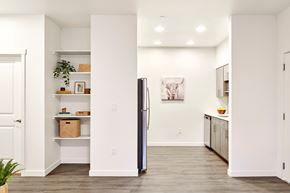Stayton apartment for rent - a kitchen with white walls and a stainless steel refrigerator