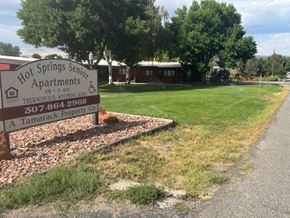 Thermopolis apartment for rent - A sign for Hot Springs Senior Apartments is in front of a grassy area.