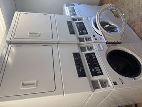 Billings apartment for rent - A white washing machine with a black control panel and a white dryer with a black control panel.