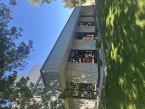 Billings apartment for rent - A modern building with a green lawn in front.