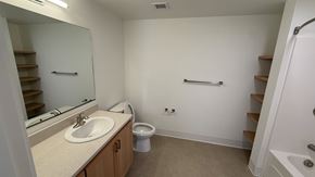 Hillsboro apartment for rent - A bathroom with a sink, toilet, and stairs.