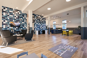 Portland apartment for rent - A modern living room with a blue and white patterned wallpaper.