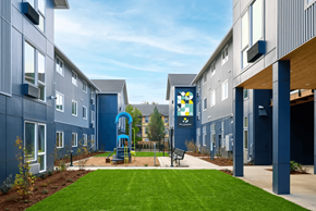 Portland apartment for rent - A playground area is located between two buildings.