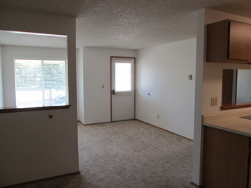 Hayden Lake apartment for rent - a view of the living room from the kitchen with the door open