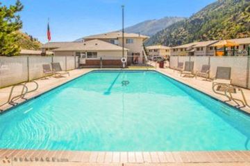 Missoula apartment for rent - A large swimming pool with a mountain in the background.