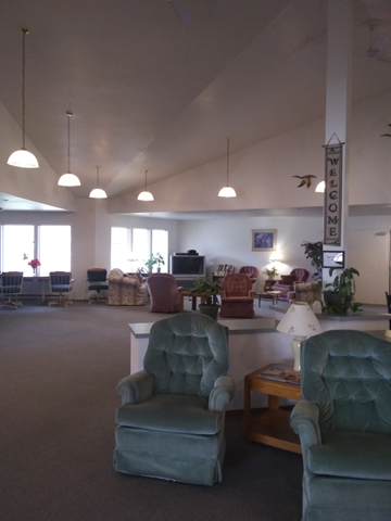 Hayden apartment for rent - a large living room with chairs and a table