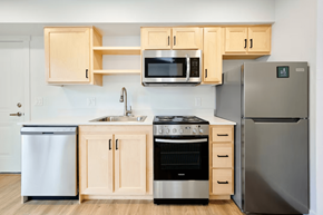 Portland apartment for rent - A kitchen with a stove, oven, refrigerator, and microwave.