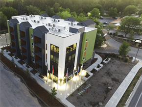 Boise apartment for rent - an aerial view of a building with lights on in front of it