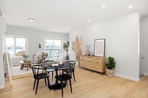 Saskatoon townhouse for rent - A dining room with a table and chairs.