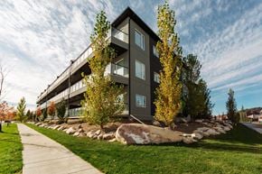Saskatoon apartment for rent - A modern building with a balcony on the second floor.